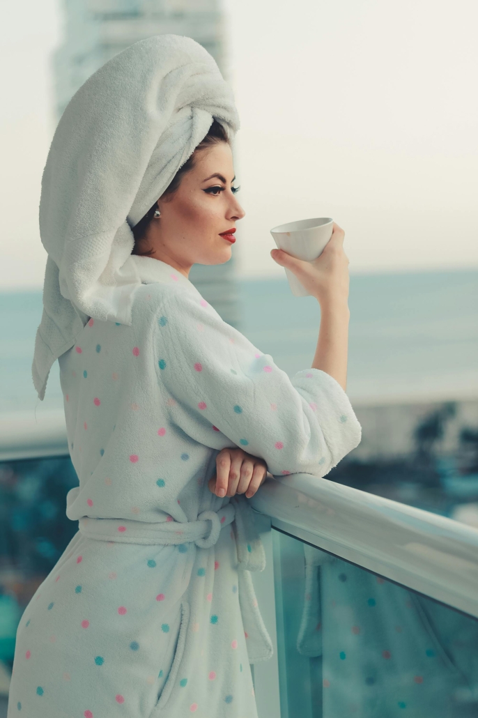 Jolly Janitors Woman Relaxing on a Balcony